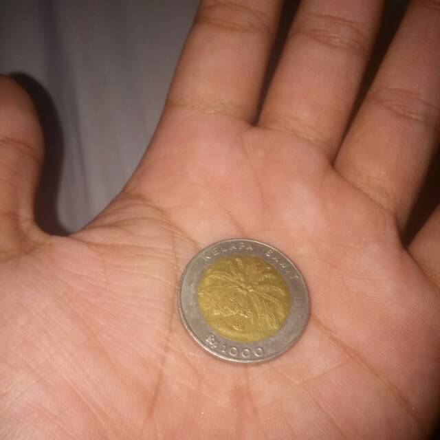 Uang kuno 1000 kelapa sawit dan 500 bunga melati