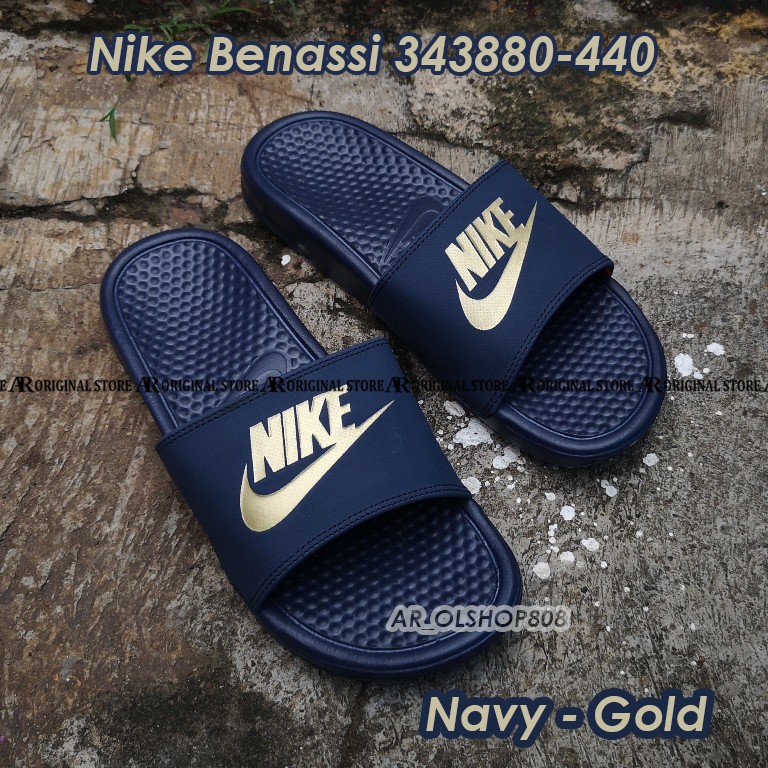 nike flip flops gold nike sign