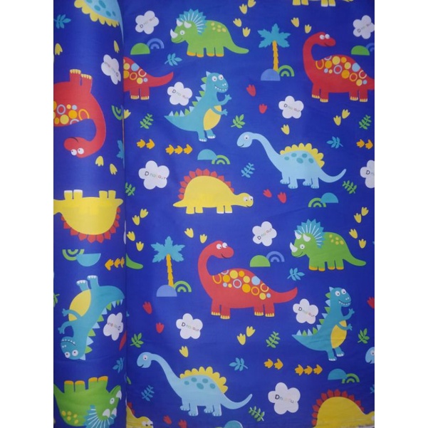 kain sprei meteran motif dinosaurus
