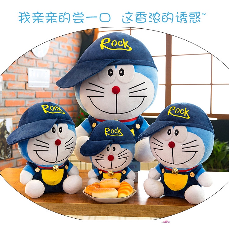 Boneka doraemon kostum pakai topi rock bahan plush