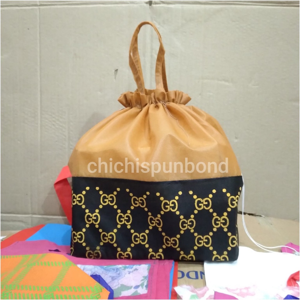 

Tas hajatan spunbond serut motif coklat 22 lusinan