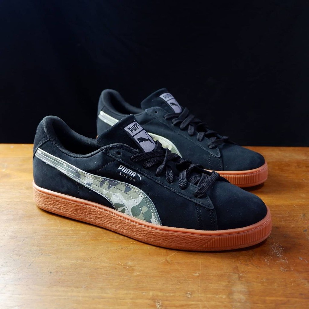 black suede pumas with brown sole