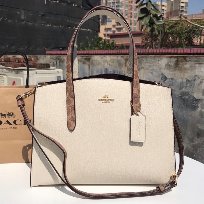 Coach women Charlie Carryall In Signature canvas - Putih