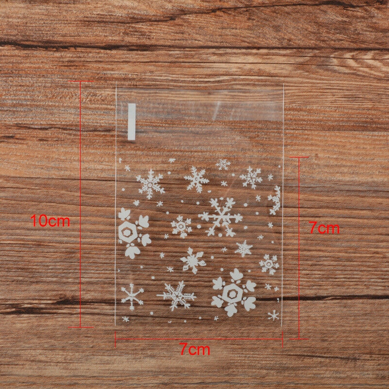 100pcs / set Kantong Plastik Cellophane Transparan Motif Snowflake Ukuran 7x7cm Dengan Perekat Untuk Biskuit