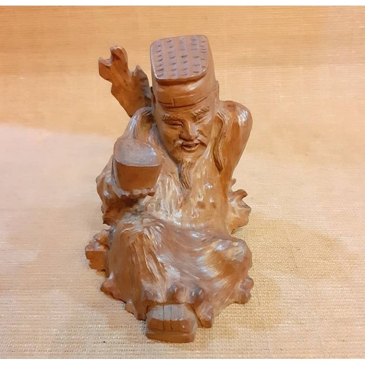 Patung Kayu Dewa Mabuk