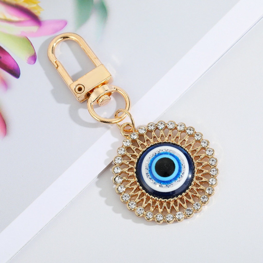 Gantungan Kunci Desain Mata Iblis Bulat Hollow Warna Biru Untuk Pria / Wanita