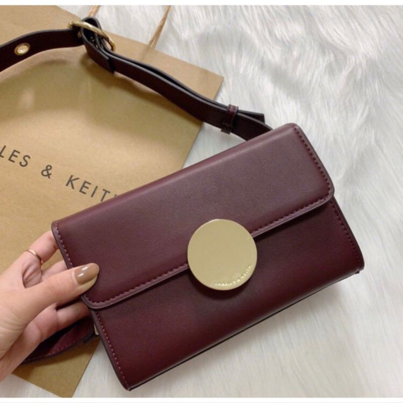 CnK Metal Buckle Grommet Sling Bag