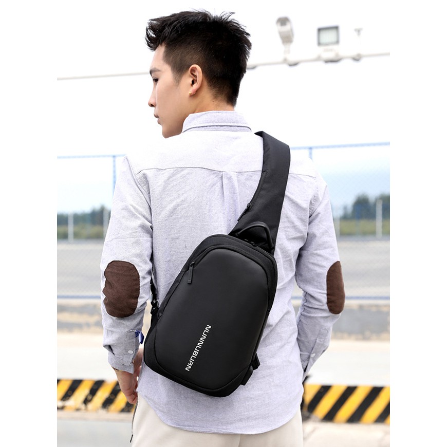 Tas Selempang Sling Bag Oxford dengan USB Charger Port / Tas Pria / Tas Selempang