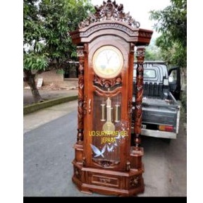 Lemari almari jam besar jam bandul model ukir bahan kayu jati