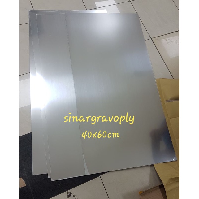 

gravoply silver teks hitam bahan gravir nametag dll ukuran 40x60cm tebal1.5mm