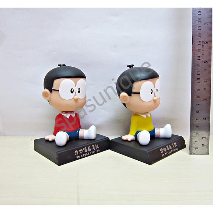 barokah pajangan mobil kepala goyang karakter boneka nobita
