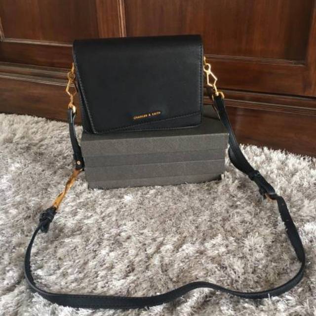 charles and keith asymmetric front flap bag