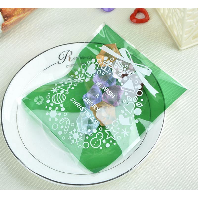 100pcs Kantong Plastik Cellophane Motif Natal Dengan Perekat Untuk Permen / Kue Kering