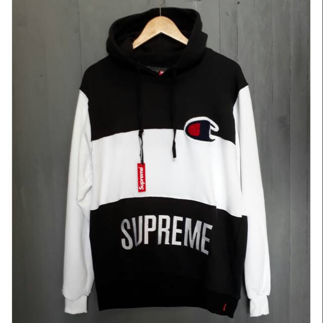 harga hoodie supreme x champion original