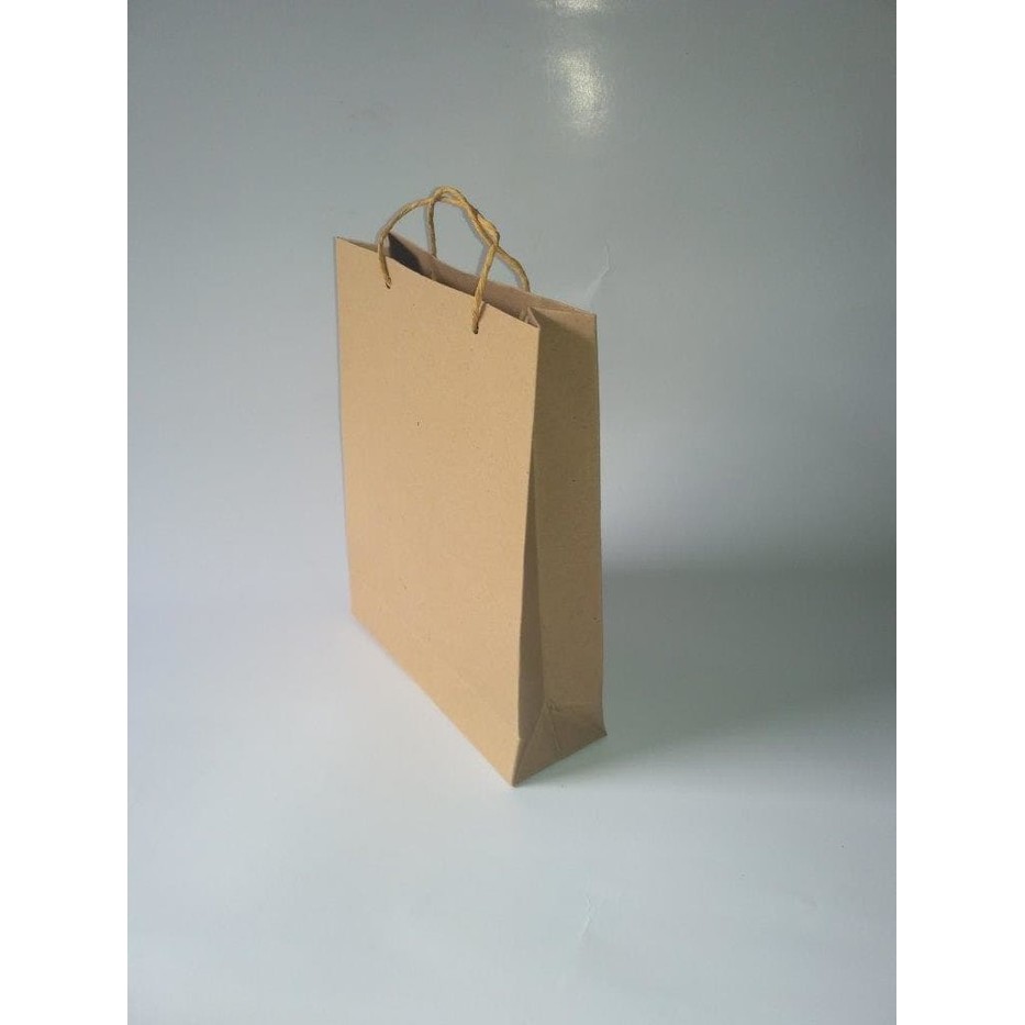 

Paper Bag Kertas Kraft Polos Uk. P18*L6*T23 cm