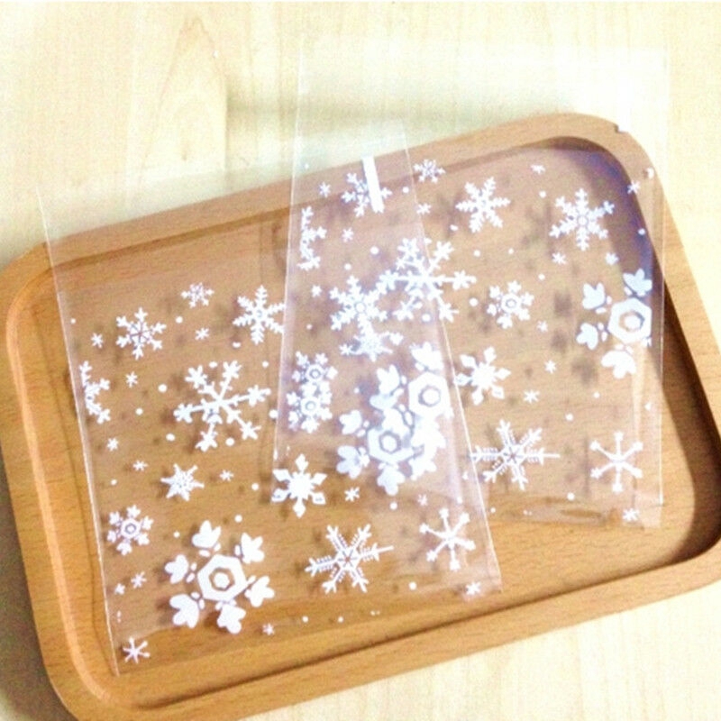 100pcs / set Kantong Plastik Cellophane Transparan Motif Snowflake Ukuran 7x7cm Dengan Perekat Untuk Biskuit