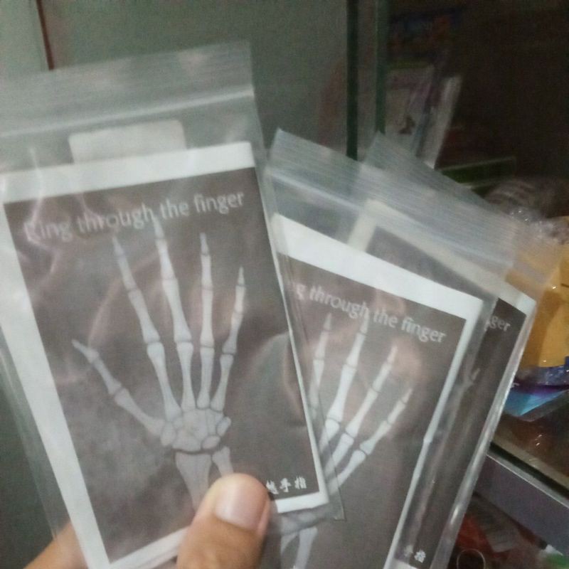 Sulap cincin tembus jari