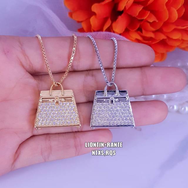 Kalung liontin nikita mirzani ,panjang liontin ±1.2cm titanium , ready semua warna