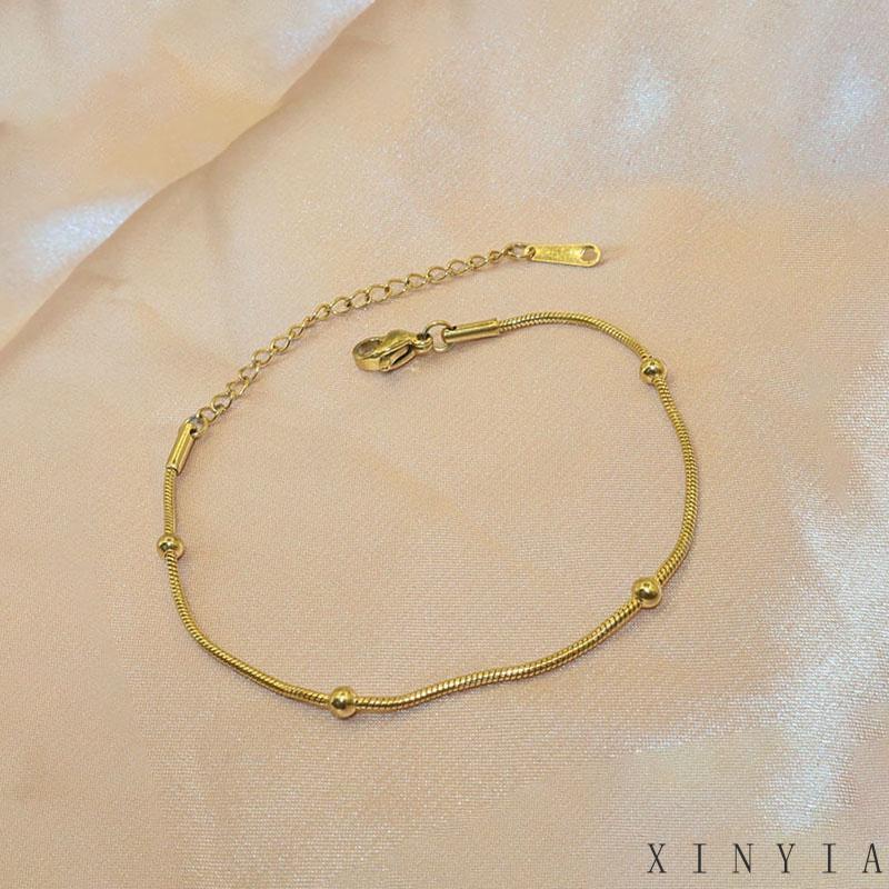 Xia.id Gelang Tangan Titanium Steel Desain Tulang Ular Hias Manik Bulat Untuk Wanita