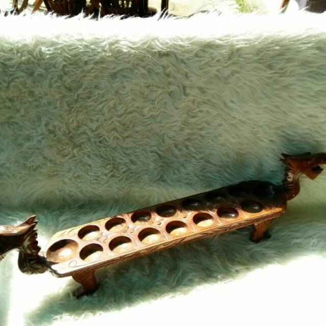 Dakon congklak ukir terbuat dari kayu jati dan biji dakon