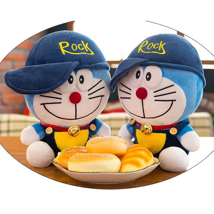 Boneka doraemon kostum pakai topi rock bahan plush