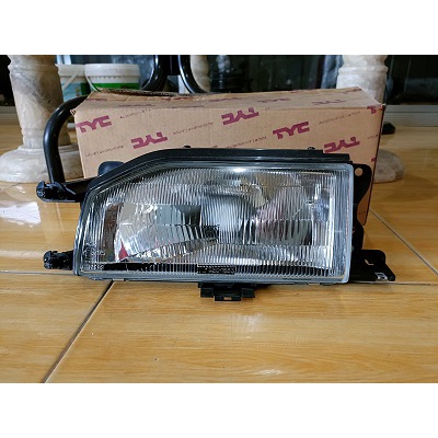 Lampu besar Mazda 323 tahun 1988 sebelah kiri Merk TYC