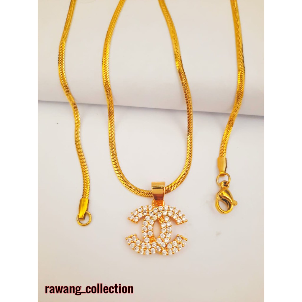 kalung titanium gold plus liontin anti karat selamanya