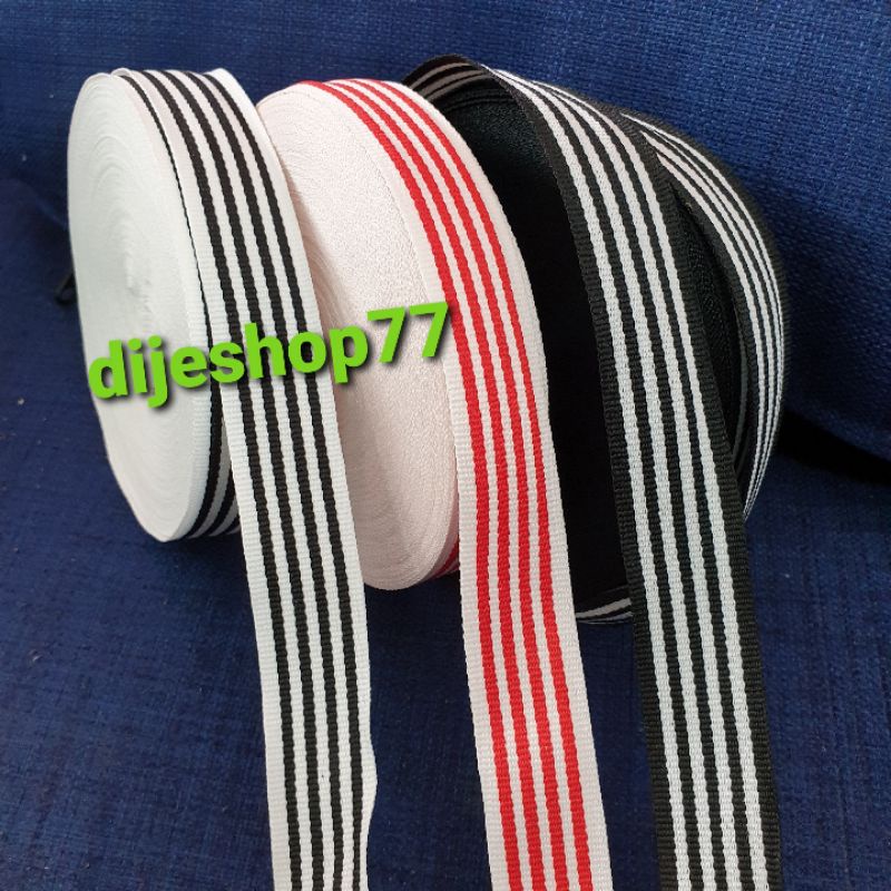 

Pita Hampers ( Bukan Grosgrain ) / Pita garis garis stripe Salur Hitam Putih Merah / Pita Kain Tidak Licin Motif 2 sisi / Pita Box / Pita Dekorasi