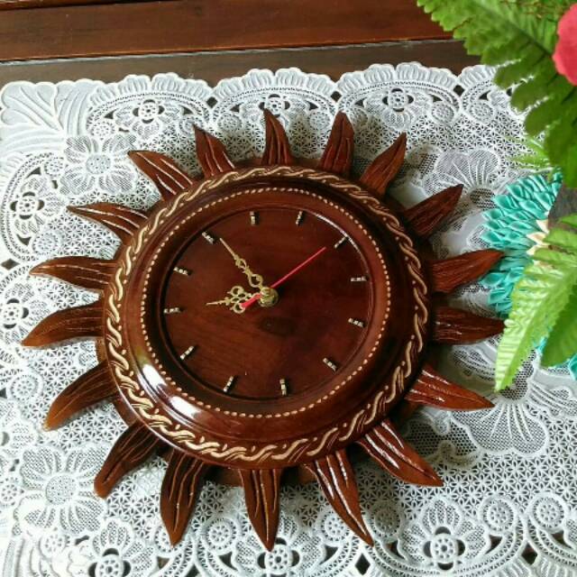 Jam dinding kayu jati model Matahari.