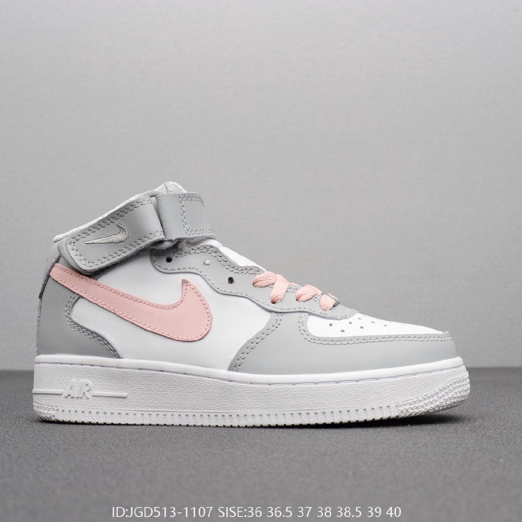 pink and white nike high tops