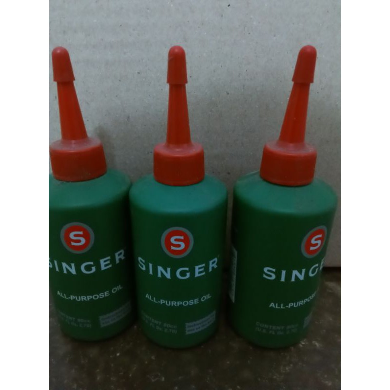 singer -oil, minyak pelumas mesin jahit, mesin obras.