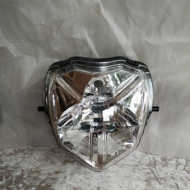 Reflektor Honda Revo Lama.