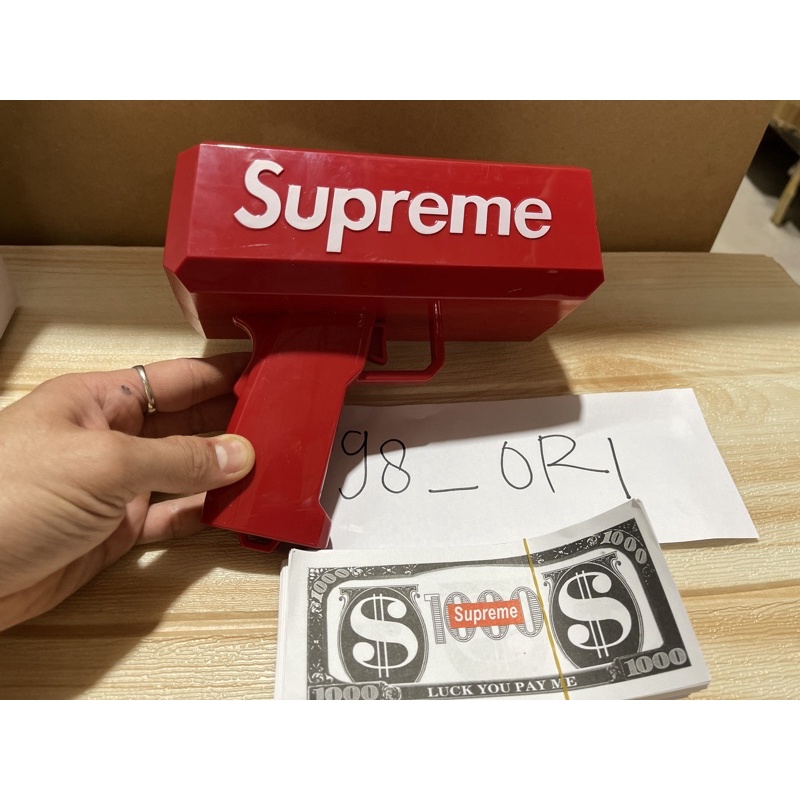 SUPREME money gun pistol uang bonus 100PCS lembar uang mainan dollar logo supreme READY STOCK