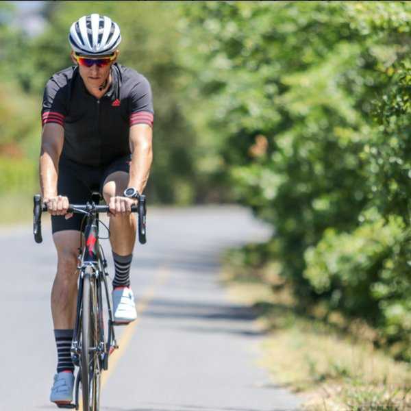 Sportsman In Fitness Attire On A Road Young Male In Goggles And A