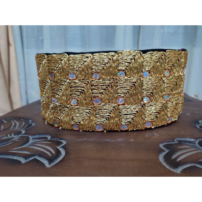 topi tapis / peci tapis motif mata kibau