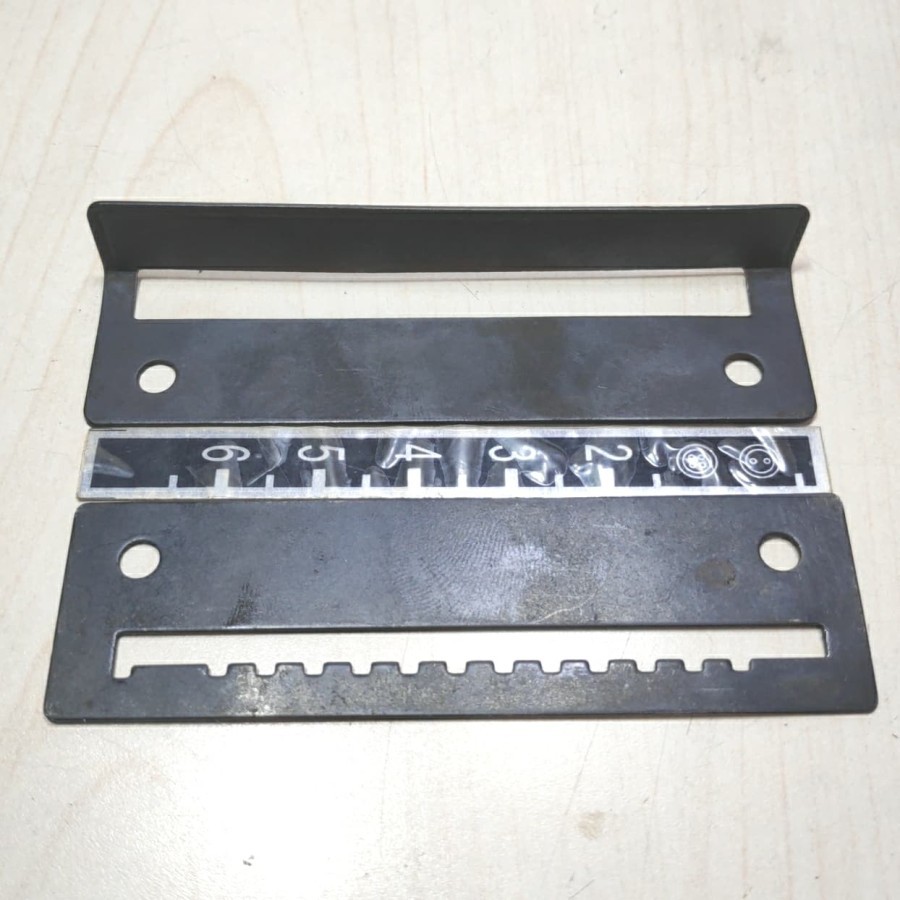 Setelan Jarak Pasang Kancing Juki 373