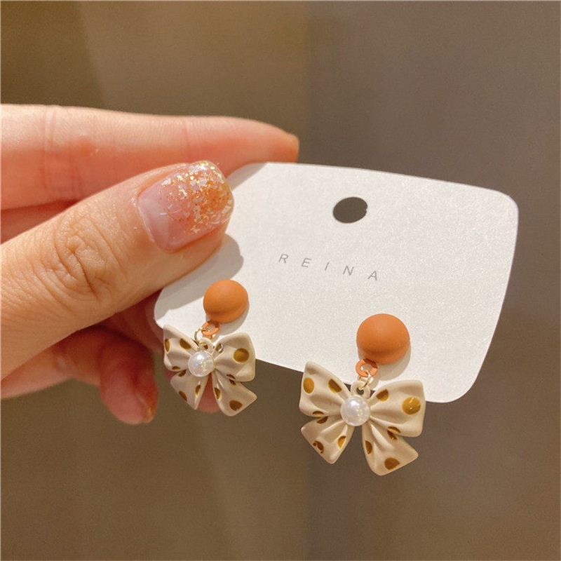 Anting Bentuk Pita Motif Polkadot Aksen Mutiara Untuk Wanita