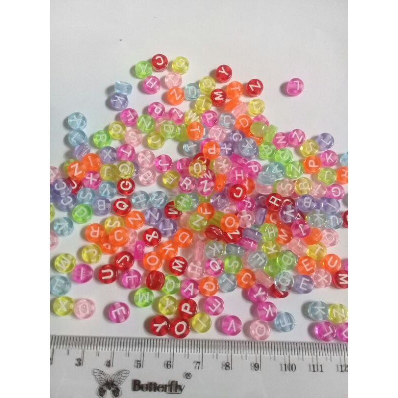 100pcs mote huruf bulat warna