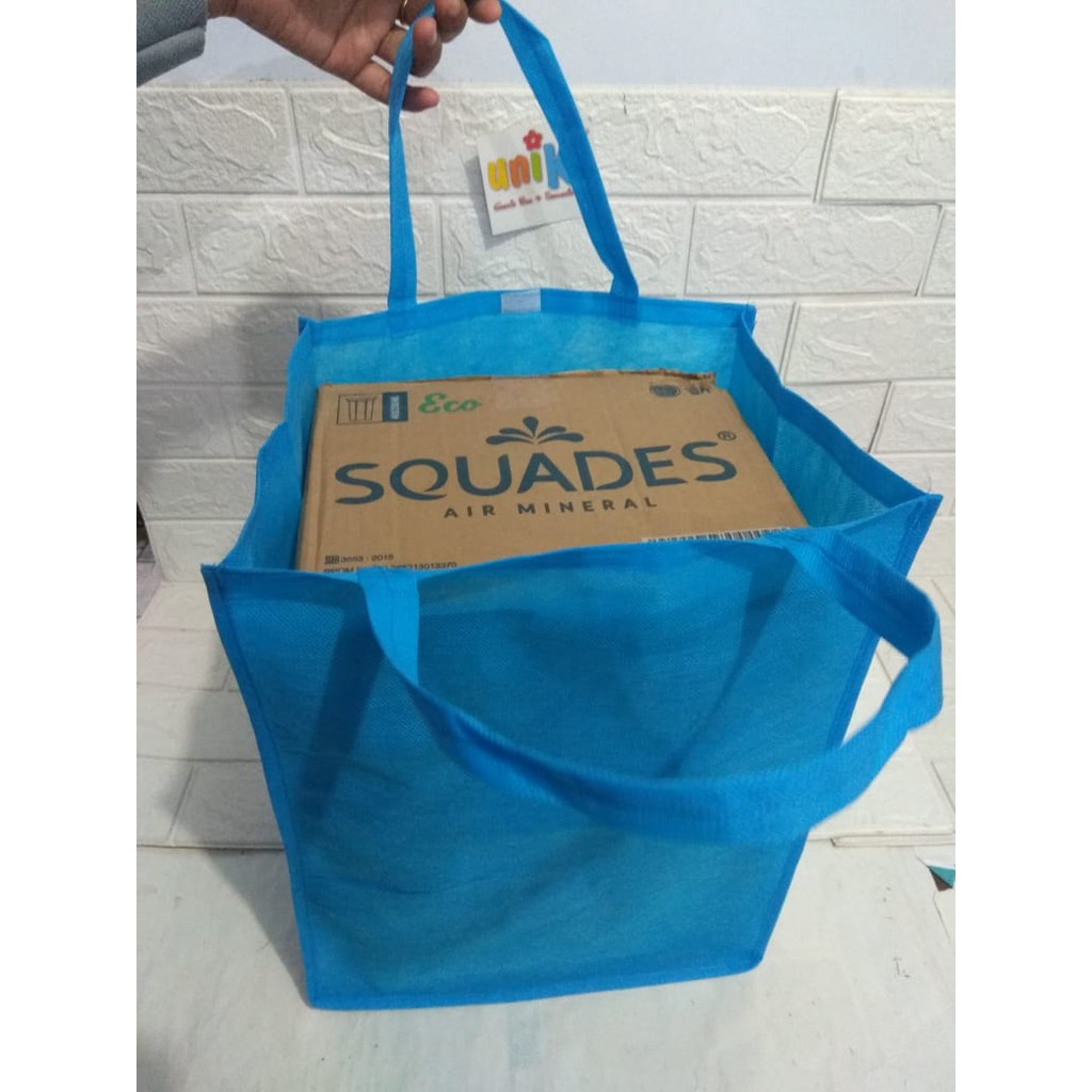 

Custom spunbond fullprint 30x10x30 tebal 80gsm warna hijau