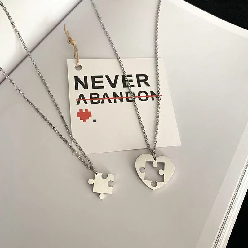 Kalung Rantai Liontin Puzzle Hati Bahan Stainless Steel Untuk Pasangan