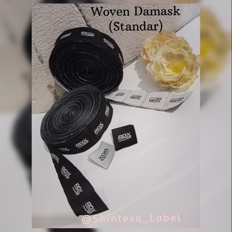 

LOGO-MEREK-LABEL WOVEN MINIM 1200 PCS BORDIR BAJU/HIJAB/CELANA/TAS Damask[BISA COSTUM]