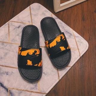 orange nike benassi slides