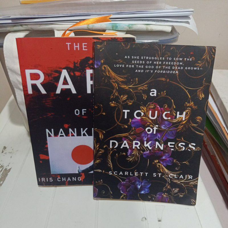 (non-ori) The rape of Nanking by iris chang and a touch of darkness by Scarlett st. clair