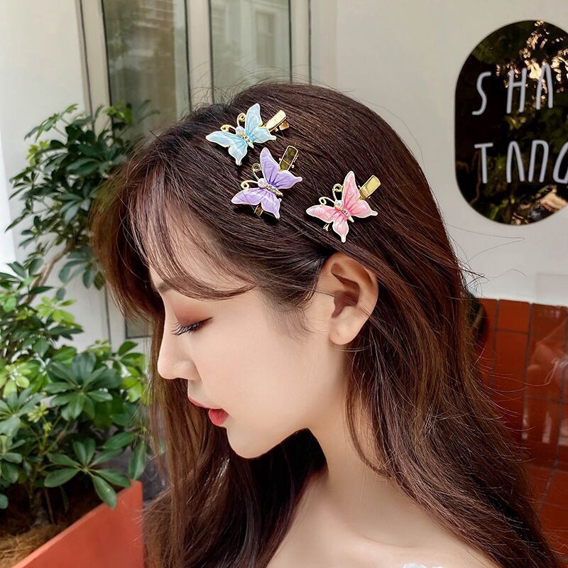 Aksesoris wanita modis versi Korea dari jepit rambut kupu-kupu mutiara warna lucu earrings ladies accesories