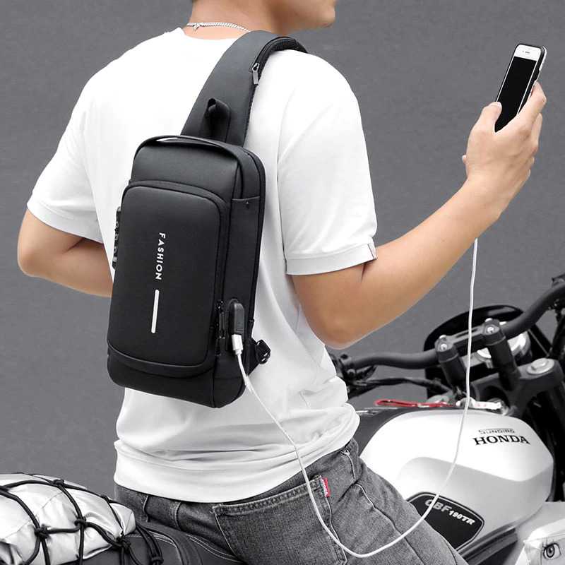 Tas Selempang Pria Wanita ideal untuk bikers pengendara motor dengan USB Charger dan gembok anti maling Slot Tas Pinggang Pria Tas Macho Fashion Sling Bag Pria Men's Multifunction Anti-theft USB Shoulder Bag Man Crossbody Cross body Travel Sling Chest Bag