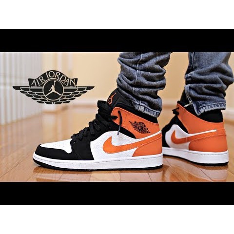 orange white and black jordan 1