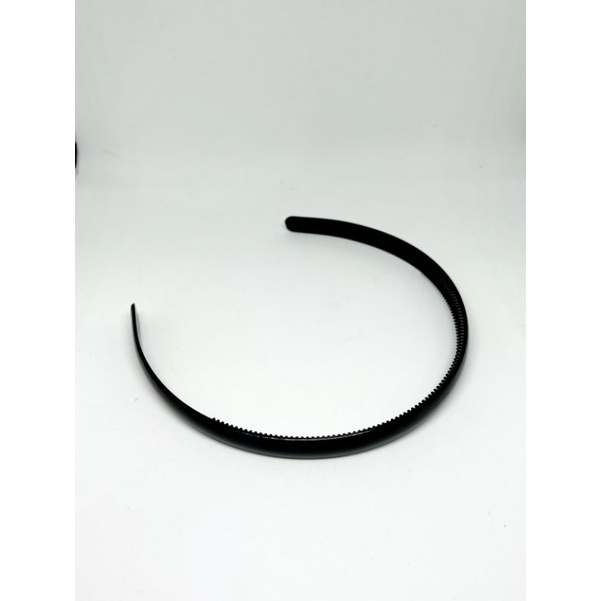 bando hitam polos bergerigi