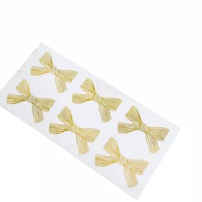 

Bowtie Ribbon Gold Foil on Transparent Base Plastic Sticker Stiker Plastik Pita Emas Dasar Bening