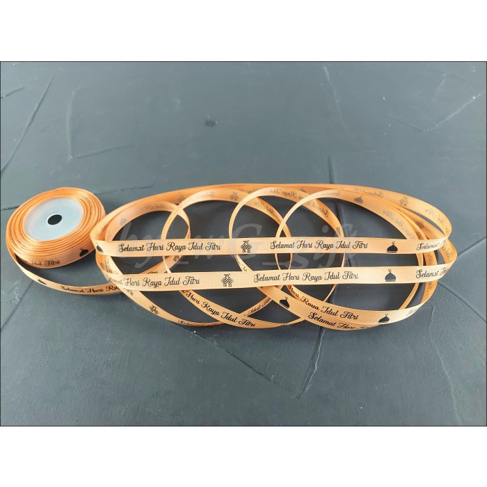 

Pita Idul Fitri -GrossGrain-CoklatMuda;Lebar 1.2cm;Motif A Pjg 20 yard