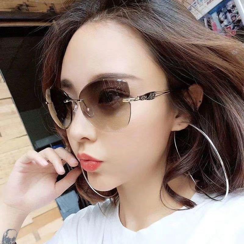 Kacamata Hitam Model Mata Kucing Rimless Perlindungan UV400 Untuk Wanita
